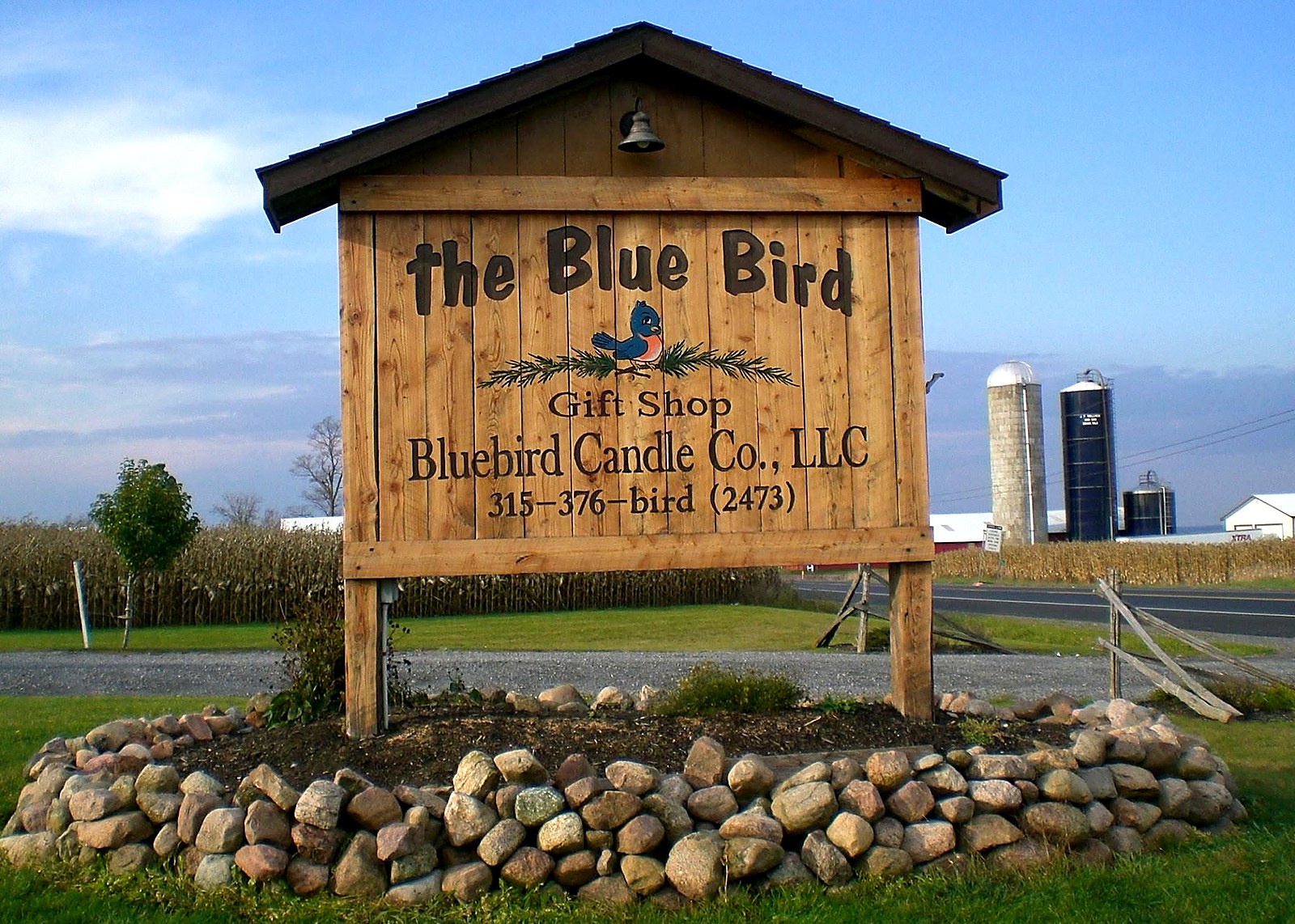 The Blue Bird Gift Shop sign for Bluebird Candle Co. on State Route 26 in Lowville, New York
