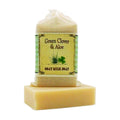 Green Clover & Aloe Goat Milk Soap bar with labeled muslin soap bag