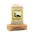 The Lodge Herbal Soap bar with labeled muslin soap bag